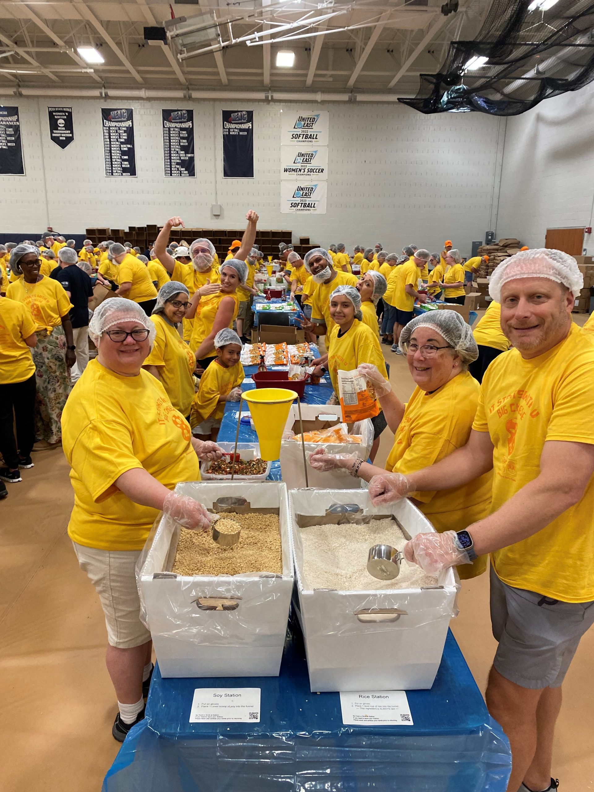 Volunteers pack meals for families in need at the United Way of Berks County’s Big Cheese 7 event Friday night at Penn State Berks, Spring Township