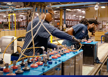 employee working at a batttery manufacturer