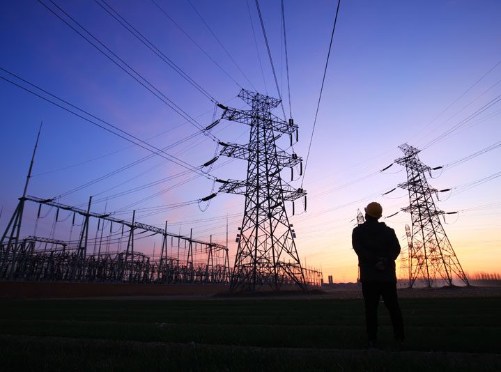 Electric towers and power lines supported by flow battery energy storage solutions.