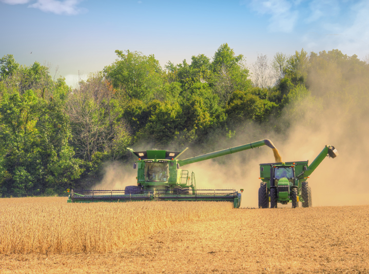 Farming equipment harvesting crops for U.S. agricultural operations.