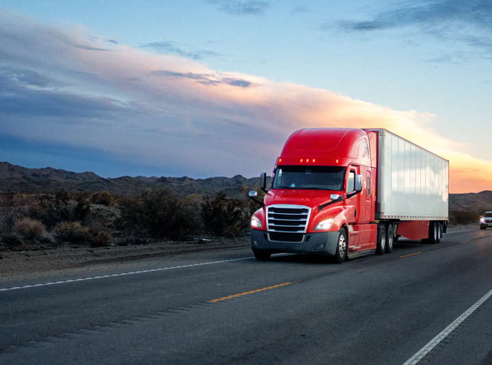 Semi-truck hauling goods for commercial transportation.